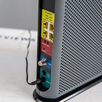 Power cord plugged in to cable modem-router